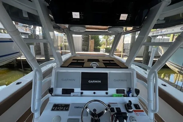  Yacht Photos Pics 2024 Invincible 46 Catamaran helm with Garmin navigation system and modern controls.