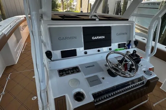  Yacht Photos Pics 2024 Invincible 46 Catamaran helm with Garmin displays and steering wheel.