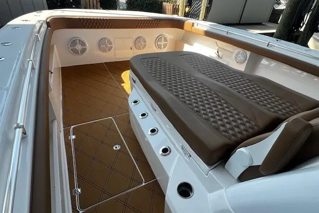  Yacht Photos Pics Luxurious interior of 2024 Invincible 46 Catamaran with brown seating and modern design.