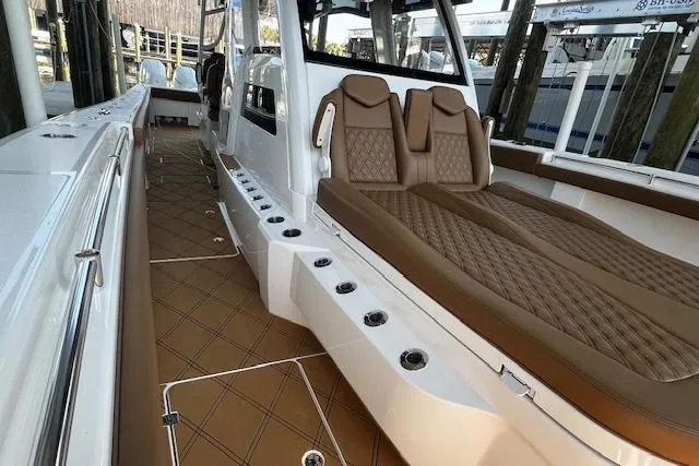  Yacht Photos Pics 2024 Invincible 46 Catamaran interior with luxurious seating and sleek design.