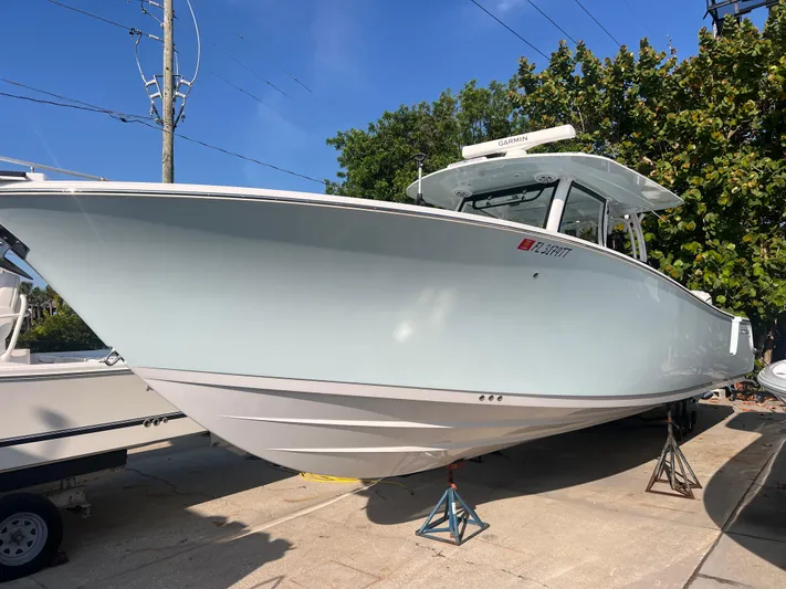  Yacht Photos Pics 2024 Sportsman 352 Open boat on display, showcasing sleek design and modern features.