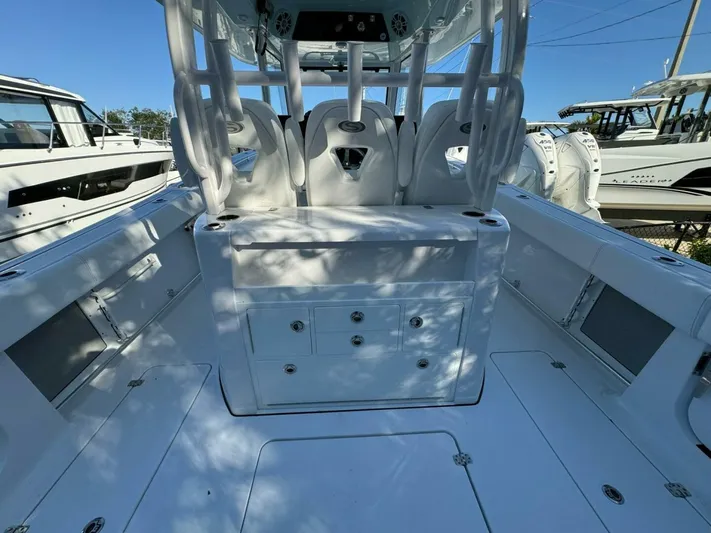  Yacht Photos Pics 2024 Sportsman 352 Open boat interior with seating and storage compartments.