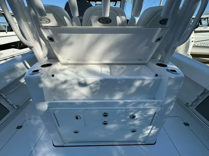  Yacht Photos Pics 2024 Sportsman 352 Open boat interior with storage compartments and seating.