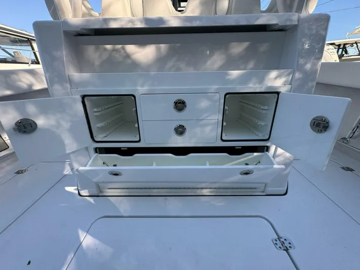  Yacht Photos Pics 2024 Sportsman 352 Open boat storage compartments with open doors and drawers.