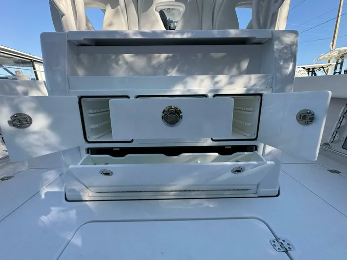  Yacht Photos Pics 2024 Sportsman 352 Open boat storage compartments with open doors and drawers.