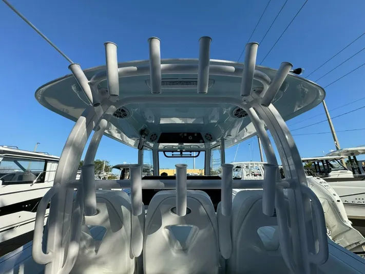  Yacht Photos Pics 2024 Sportsman 352 Open boat with rod holders and seating, viewed from the rear.