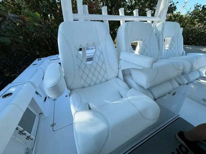  Yacht Photos Pics 2024 Sportsman 352 Open boat with luxurious white seating and armrests.
