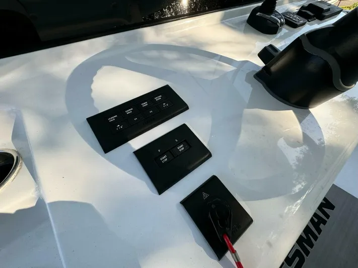  Yacht Photos Pics Control panel on 2024 Sportsman 352 Open boat, featuring various switches and buttons.