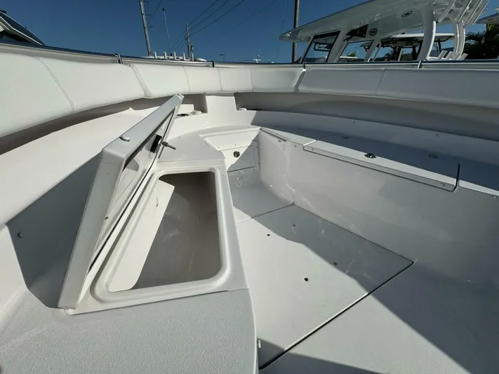  Yacht Photos Pics 2024 Sportsman 352 Open boat interior with open storage compartment.