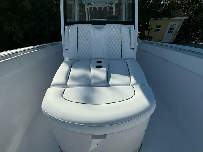 Yacht Photos Pics 2024 Sportsman 352 Open boat with luxurious white seating and diamond stitching.
