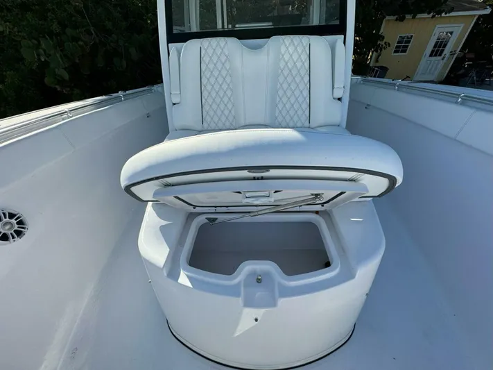 Yacht Photos Pics 2024 Sportsman 352 Open boat seat with storage compartment, white upholstery, and sleek design.