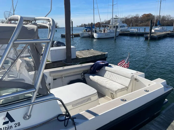 Five Belles Yacht Photos Pics 2001 Albin 28TE boat docked at marina with American flag.