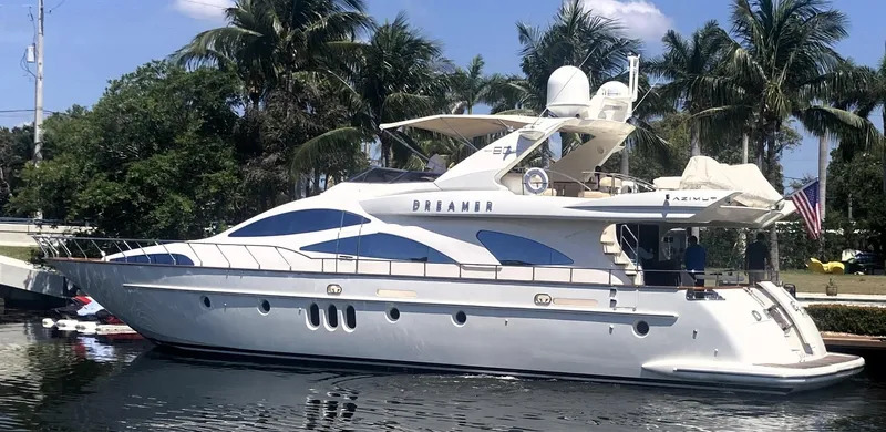 Dreamer Yacht Photos Pics 2005 Azimut 80 Carat yacht docked by palm trees, named "Dreamer."