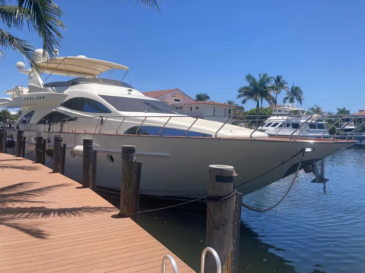 Dreamer Yacht Photos Pics Luxury 2005 Azimut 80 Carat yacht docked in sunny marina setting.