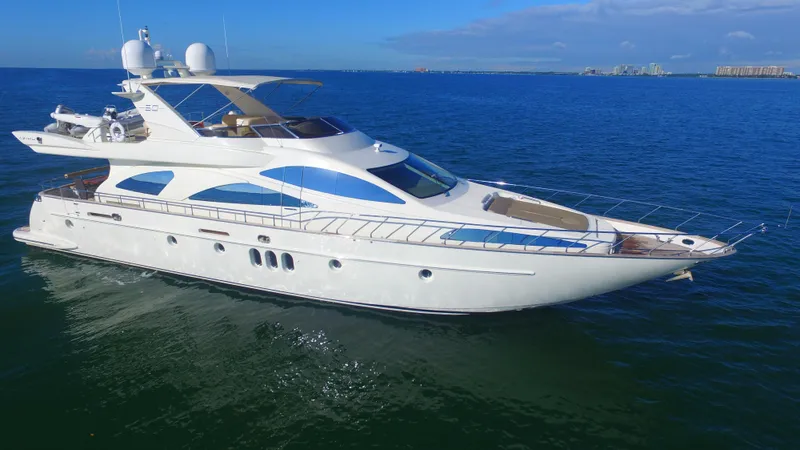 Dreamer Yacht Photos Pics Luxury 2005 Azimut 80 Carat yacht cruising on open blue sea.