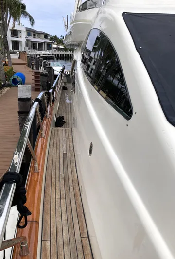 Dreamer Yacht Photos Pics Side view of 2005 Azimut 80 Carat yacht docked at marina.