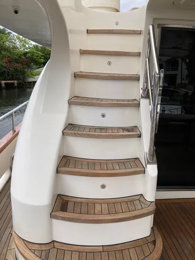 Dreamer Yacht Photos Pics Staircase on 2005 Azimut 80 Carat yacht with wooden steps and sleek design.