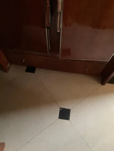 Dreamer Yacht Photos Pics Interior of 2005 Azimut 80 Carat yacht with wooden cabinetry and tiled flooring.