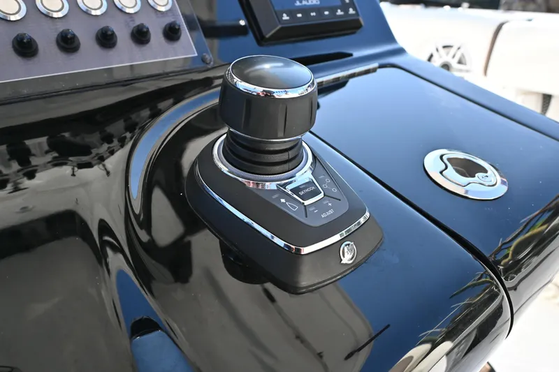  Yacht Photos Pics Control panel of 2025 Tidewater 320 CC Adventure boat with joystick and buttons.