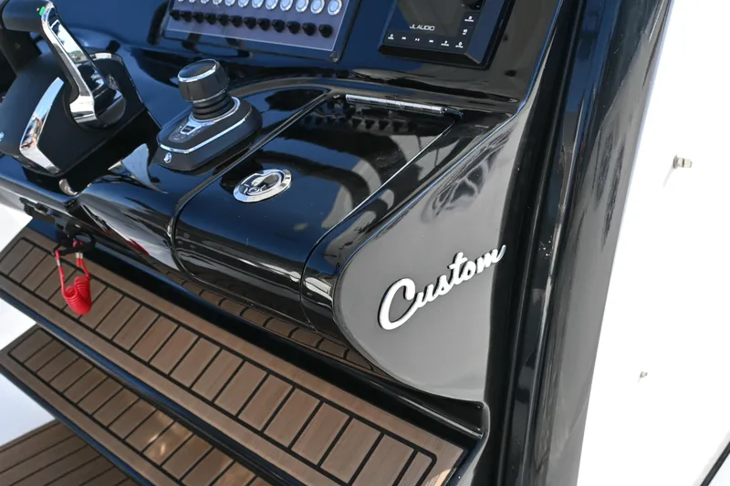  Yacht Photos Pics 2025 Tidewater 320 CC Adventure boat dashboard with custom controls and sleek design.