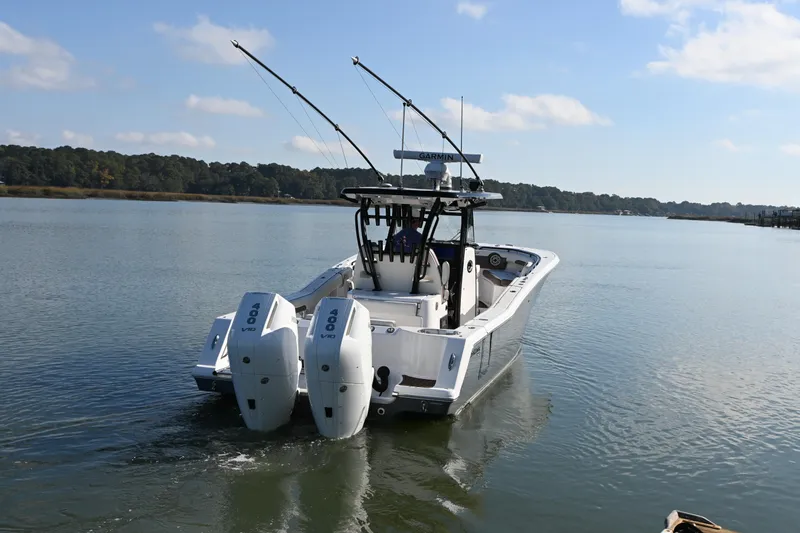  Yacht Photos Pics 2025 Tidewater 320 CC Adventure boat with dual 400 V10 engines on calm water.