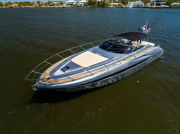 Andiamo Yacht Photos Pics 2014 Riva 52 LE luxury yacht on calm water, featuring sleek design and spacious deck.
