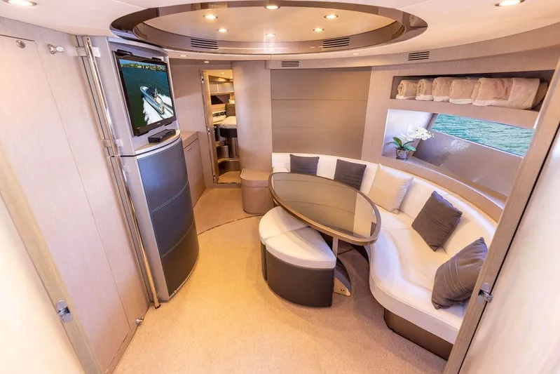 Andiamo Yacht Photos Pics Luxurious interior of a 2014 Riva 52 LE yacht with elegant seating and modern decor.