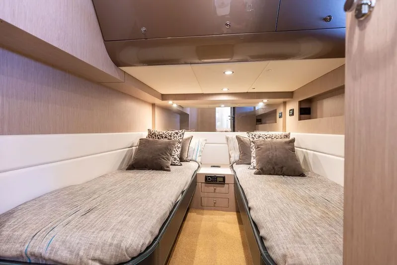 Andiamo Yacht Photos Pics Luxurious cabin interior of 2014 Riva 52 LE yacht with twin beds and modern decor.