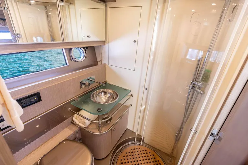 Andiamo Yacht Photos Pics Luxurious bathroom in 2014 Riva 52 LE yacht with modern fixtures and shower.