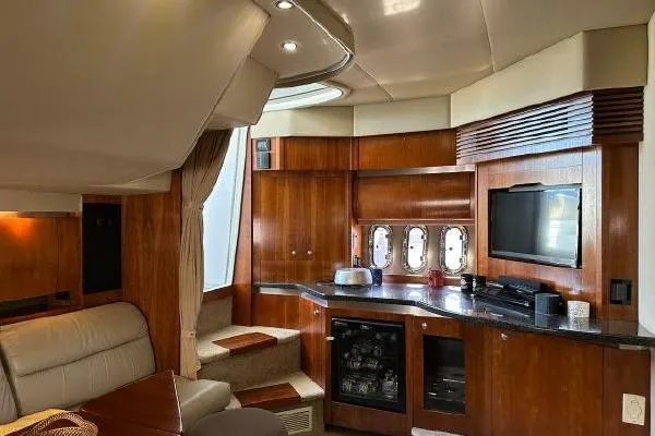  Yacht Photos Pics Luxurious interior of 2005 Cruisers 420 yacht with wood finish and modern amenities.
