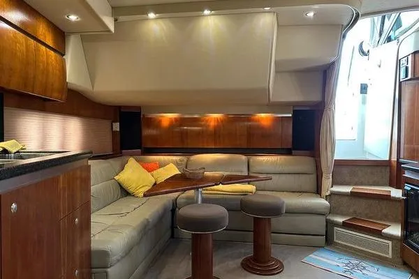  Yacht Photos Pics Luxurious interior of 2005 Cruisers 420 yacht with plush seating and elegant wood finishes.