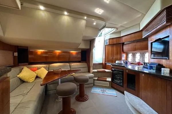  Yacht Photos Pics Luxurious 2005 Cruisers 420 yacht interior with elegant wood finishes and cozy seating area.