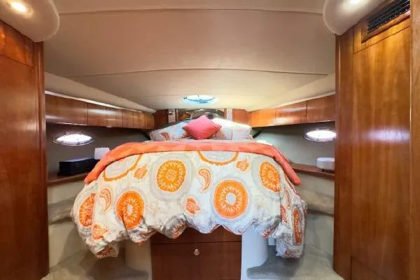  Yacht Photos Pics Luxurious 2005 Cruisers 420 yacht cabin with cozy bed and elegant wood finish.