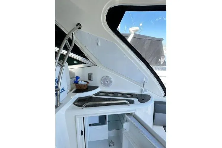  Yacht Photos Pics 2005 Cruisers 420 yacht interior with sleek kitchenette and modern design elements.