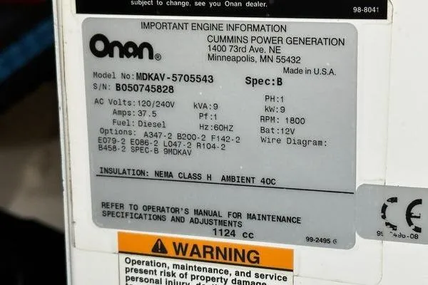  Yacht Photos Pics Label on Onan generator, model MDKAV-5705543, with specifications and warning notice.