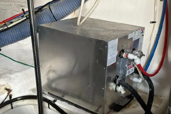  Yacht Photos Pics Engine room of 2005 Cruisers 420 yacht with water heater and hoses.