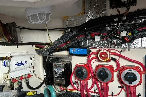  Yacht Photos Pics Engine room of a 2005 Cruisers 420 boat with wiring and control panels.