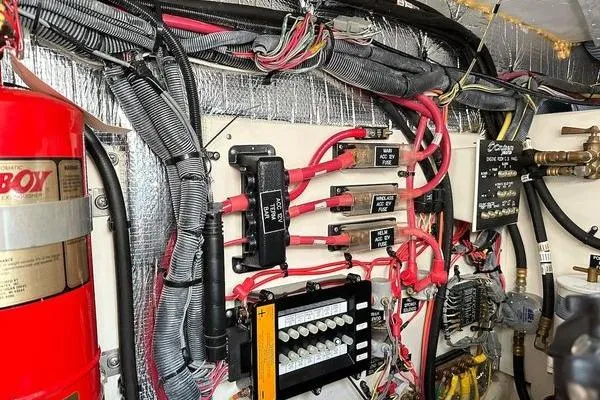  Yacht Photos Pics Electrical wiring and components inside a 2005 Cruisers 420 boat engine room.