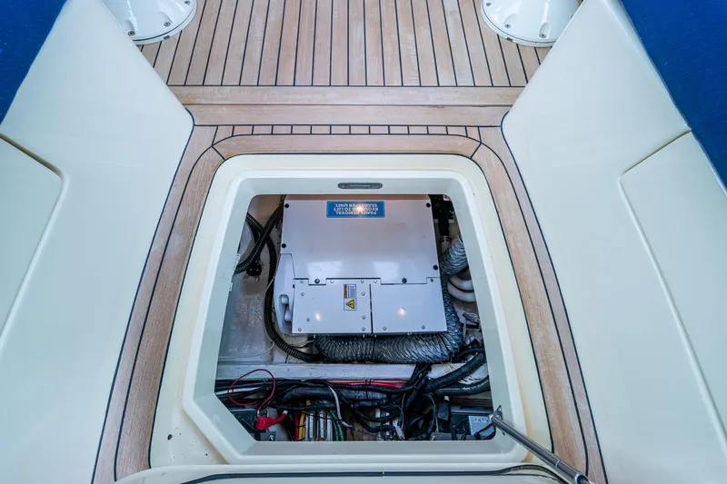 Ruckus Yacht Photos Pics Engine compartment of 2017 Hinckley Picnic Boat 37 MKIII with visible mechanical components.