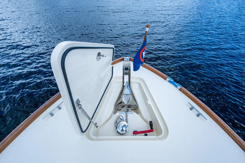 Ruckus Yacht Photos Pics Hinckley Picnic Boat 37 MKIII 2017 bow with anchor hatch open on calm water.