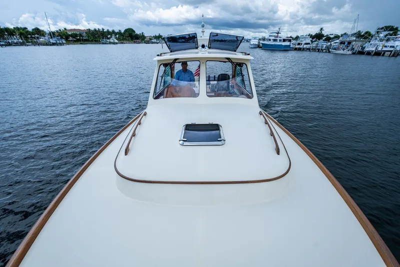 Ruckus Yacht Photos Pics 2017 Hinckley Picnic Boat 37 MKIII cruising on a calm waterway.