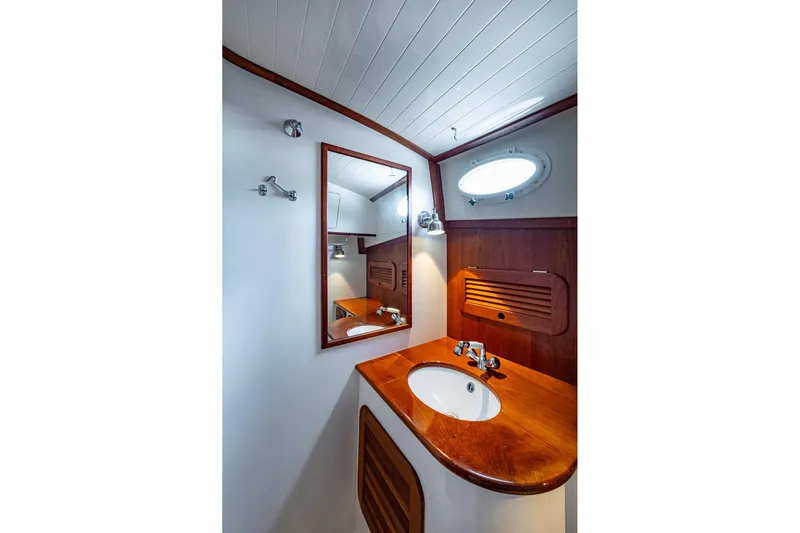 Ruckus Yacht Photos Pics Elegant bathroom interior of 2017 Hinckley Picnic Boat 37 MKIII with wooden accents.