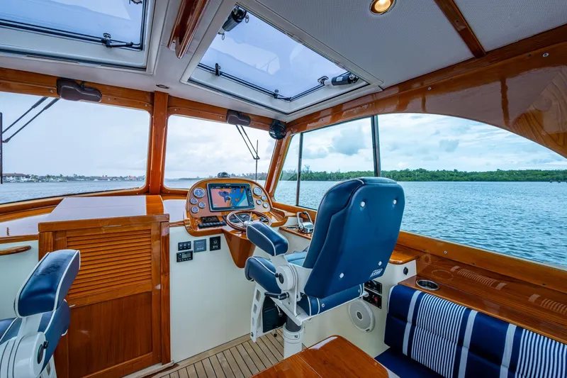 Ruckus Yacht Photos Pics Interior of 2017 Hinckley Picnic Boat 37 MKIII with helm and scenic water view.