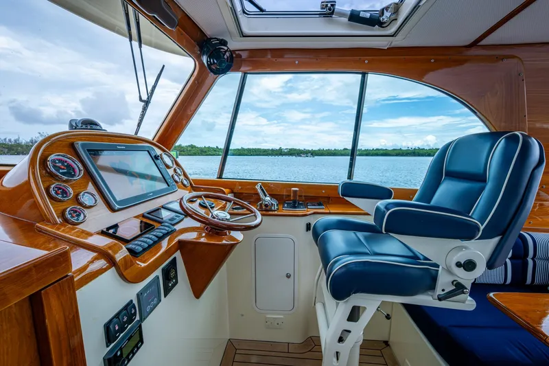 Ruckus Yacht Photos Pics 2017 Hinckley Picnic Boat 37 MKIII helm with luxurious seating and navigation controls.