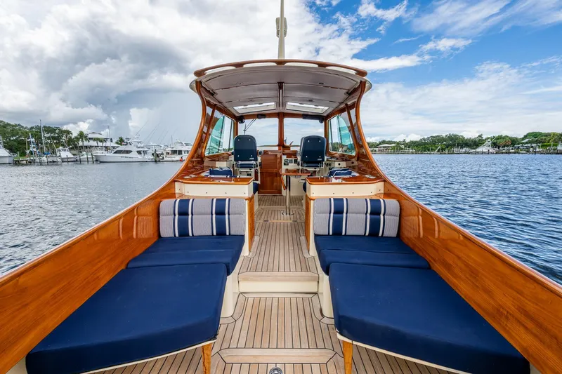 Ruckus Yacht Photos Pics 2017 Hinckley Picnic Boat 37 MKIII with elegant wooden interior on calm water.