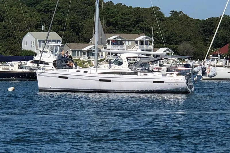 "meru" Yacht Photos Pics 2019 Catalina 425 sailboat docked in a marina with houses in the background.