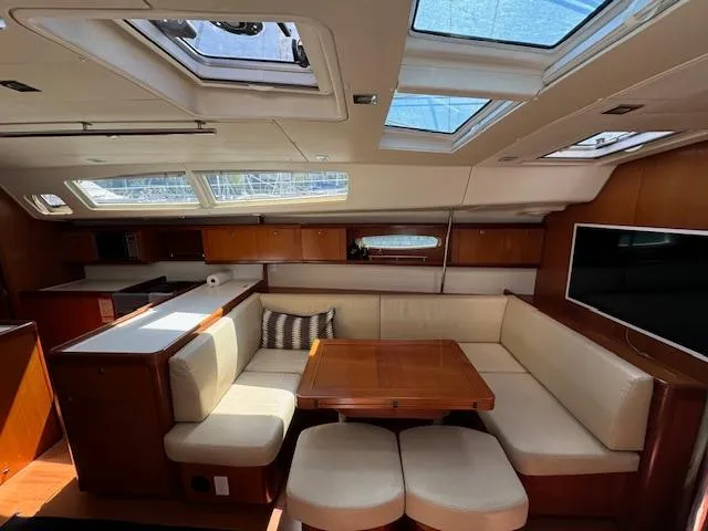 Simone Yacht Photos Pics Interior of 2007 Beneteau 490 yacht with spacious seating, skylights, and modern amenities.