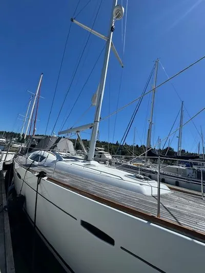 Simone Yacht Photos Pics 2007 Beneteau 490 sailboat docked under clear blue sky.