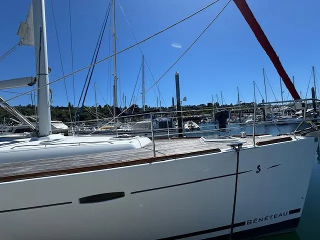 Simone Yacht Photos Pics Sailboat Beneteau 490, 2007 model, docked at marina under clear blue sky.