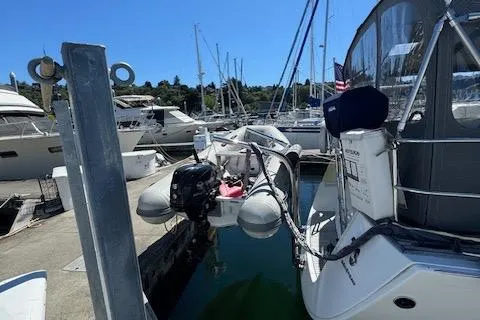 Simone Yacht Photos Pics Beneteau 490 yacht docked at marina, 2007 model, with inflatable dinghy attached.